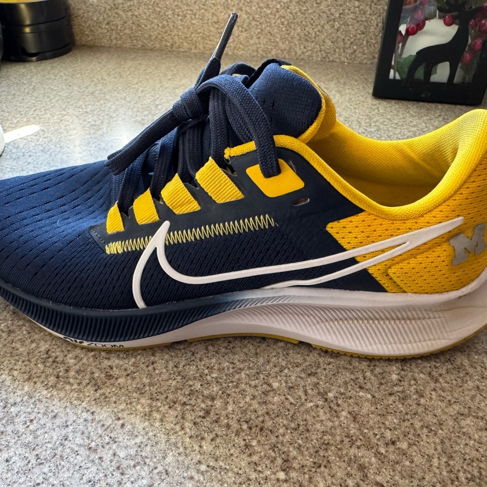 Nike kids or women’s Michigan
 Navy and Yellow Running Shoes